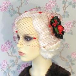 Red dotty birdcage veil.